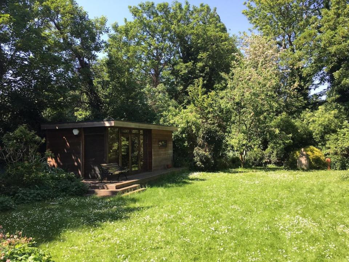The secluded wooden studio in a sunny green Highgate garden